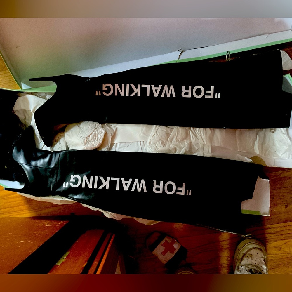 Off white “for walking” boots. Thigh high.